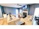 Inviting living room with hardwood floors, fireplace, and comfortable neutral-toned furniture at 113 Citadel Dr, Hampton, GA 30228