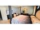 Bed room is complete with a luxury four-poster bed and is complemented by fine furniture and natural light at 113 Citadel Dr, Hampton, GA 30228