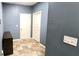 Mud room features neutral tile flooring and access to storage spaces at 113 Citadel Dr, Hampton, GA 30228