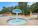 Splash pad near pool area with umbrellas, lounge seating, and side tables at 113 Citadel Dr, Hampton, GA 30228