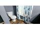 Bathroom showcasing a standard toilet, wood-look flooring, and a window with decorative floral curtains at 113 Citadel Dr, Hampton, GA 30228