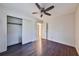 Spacious bedroom with a closet and hardwood floors, offering ample storage and a clean, modern look at 570 Harris Sw Ct, Marietta, GA 30060