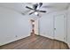Bright bedroom with hardwood floors and a ceiling fan, offering a comfortable and inviting space at 570 Harris Sw Ct, Marietta, GA 30060