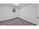 Bedroom with carpet, natural light from window, and neutral walls at 570 Harris Sw Ct, Marietta, GA 30060
