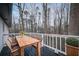 Relaxing wooden deck for outdoor dining, surrounded by lush greenery at 570 Harris Sw Ct, Marietta, GA 30060