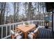 Outdoor dining deck featuring a table with cushioned seating and stainless steel grill at 570 Harris Sw Ct, Marietta, GA 30060