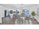 Modern kitchen and dining area with stainless steel appliances and bright natural light at 570 Harris Sw Ct, Marietta, GA 30060