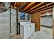 Basement laundry room features washer, dryer, and window at 570 Harris Sw Ct, Marietta, GA 30060