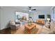 Inviting living room showcasing dark wood floors, a large window, and an open dining area at 570 Harris Sw Ct, Marietta, GA 30060