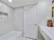 Bright bathroom features a tub with tile surround and decorative niche for added style at 6851 Roswell Rd # D-6, Atlanta, GA 30328