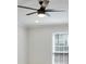 Bedroom featuring a ceiling fan and a window with blinds for a comfortable and private space at 6851 Roswell Rd # D-6, Atlanta, GA 30328