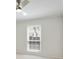 Bright bedroom featuring a ceiling fan, large window and plush carpeting for a cozy retreat at 6851 Roswell Rd # D-6, Atlanta, GA 30328