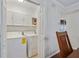 Laundry room with washer, dryer, and overhead storage for convenient chores at 6851 Roswell Rd # D-6, Atlanta, GA 30328