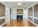 Elegant living room featuring a fireplace, hardwood floors, and classic white trim at 6851 Roswell Rd # D-6, Atlanta, GA 30328