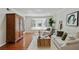 Cozy living room with hardwood floors, a bay window, and a comfortable seating area at 6851 Roswell Rd # D-6, Atlanta, GA 30328