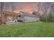 Spacious backyard featuring a covered patio, ample green space, and an inviting outdoor entertainment area at 121 Tricias Way, Temple, GA 30179