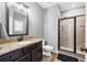 Updated bathroom features a granite countertop, black fixtures, and tile stand up shower at 121 Tricias Way, Temple, GA 30179
