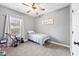 Cozy bedroom with carpet, light grey paint, a ceiling fan, and natural light at 121 Tricias Way, Temple, GA 30179