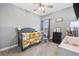 Charming Bedroom with a crib, soft carpet, and warm, inviting décor at 121 Tricias Way, Temple, GA 30179