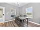Bright dining area with natural light, wood-look flooring, and seating for four at 121 Tricias Way, Temple, GA 30179