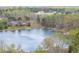 Scenic lake view surrounded by lush trees and elegant homes, offering a tranquil and picturesque setting at 121 Tricias Way, Temple, GA 30179