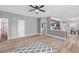 Comfortable living room leading to a dining area with hardwood floors and neutral color palette at 121 Tricias Way, Temple, GA 30179