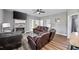Spacious living room featuring a fireplace and comfortable leather seating, ideal for relaxing at 121 Tricias Way, Temple, GA 30179