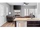 Inviting living room with a stone fireplace and comfortable seating at 121 Tricias Way, Temple, GA 30179