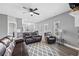 Bright living space featuring a cozy seating arrangement, a fireplace, and easy access to the kitchen at 121 Tricias Way, Temple, GA 30179