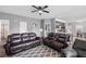 Open-concept living area with comfortable seating and a view of the kitchen, ideal for gatherings at 121 Tricias Way, Temple, GA 30179