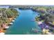 Aerial view of a beautiful lake with multiple docks and lakeside homes at 2220 Lanier Harbor Pt, Buford, GA 30518