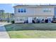 A townhome backyard with a lush lawn and quaint patio area at 2220 Lanier Harbor Pt, Buford, GA 30518