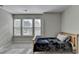 Well-lit bedroom with large windows, offering great natural light and a serene ambiance at 2220 Lanier Harbor Pt, Buford, GA 30518