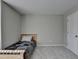 Clean bedroom with a twin bed and plenty of natural light at 2220 Lanier Harbor Pt, Buford, GA 30518