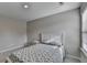 Light-filled bedroom with a bed and window, offering a relaxing and inviting space at 2220 Lanier Harbor Pt, Buford, GA 30518