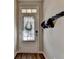 Inviting entryway featuring a stylish front door, wood floors, and modern decor at 2220 Lanier Harbor Pt, Buford, GA 30518