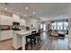 Well-lit kitchen with a granite island, stainless appliances, hardwood floors, and open layout at 2220 Lanier Harbor Pt, Buford, GA 30518