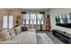 Bright living room with a comfortable sofa, hardwood floors, and large windows at 2220 Lanier Harbor Pt, Buford, GA 30518