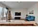 Comfortable living room with contemporary furniture, a large window, and hardwood floors at 2220 Lanier Harbor Pt, Buford, GA 30518