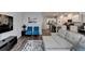 Living area seamlessly connects to kitchen, featuring hardwood floors and ample natural light at 2220 Lanier Harbor Pt, Buford, GA 30518