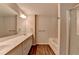 Bright main bathroom featuring a long vanity, double sinks, and separate shower and tub at 2220 Lanier Harbor Pt, Buford, GA 30518