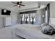 Beautiful main bedroom featuring a tray ceiling, large windows, and modern decor at 2220 Lanier Harbor Pt, Buford, GA 30518