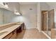 Spacious bathroom featuring double vanity, large mirror, and tiled shower at 2723 Ivy Bluff Ct, Buford, GA 30519