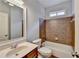 Bathroom with shower/tub, single vanity, and tiled walls at 2723 Ivy Bluff Ct, Buford, GA 30519