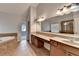 This bathroom features a large tub, a vanity, and a view to the next room at 2723 Ivy Bluff Ct, Buford, GA 30519