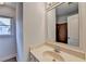 Well-lit bathroom features a large mirror, vanity sink and tiled shower stall at 2723 Ivy Bluff Ct, Buford, GA 30519