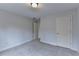 Cozy bedroom with neutral colors and soft carpeting at 2723 Ivy Bluff Ct, Buford, GA 30519