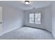 Comfortable bedroom with plush carpeting and a window for natural light at 2723 Ivy Bluff Ct, Buford, GA 30519
