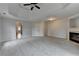 Bedroom features carpet, ceiling fan, and a fireplace at 2723 Ivy Bluff Ct, Buford, GA 30519