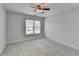 Simple bedroom with a window for natural light and comfortable carpeting at 2723 Ivy Bluff Ct, Buford, GA 30519